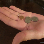 hand holding coins
